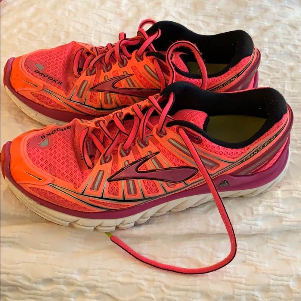 Neon pink Brooks running shoes
